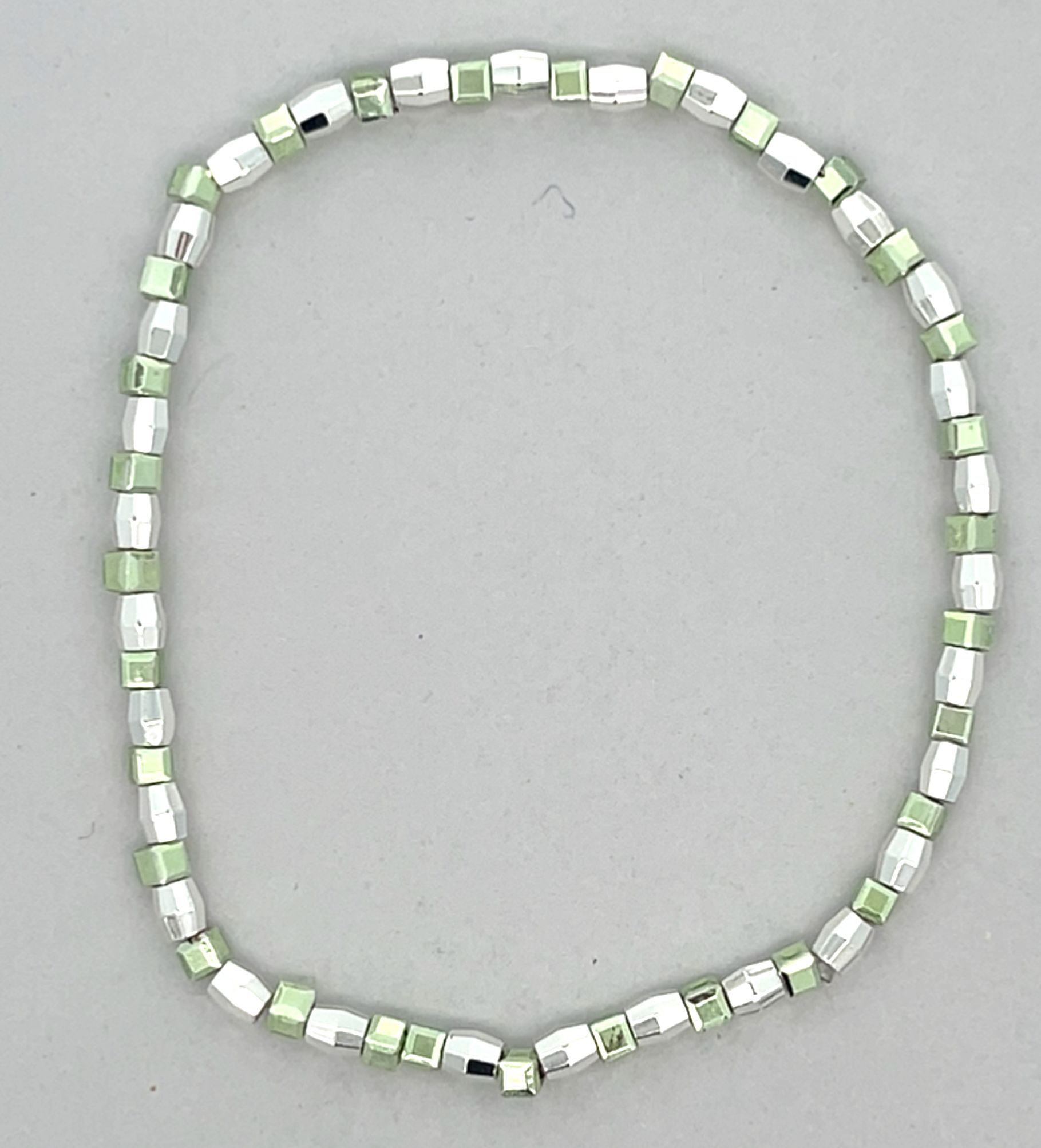 LIGHT GREEN AND SILVER BEADED STRETCH BRACELET